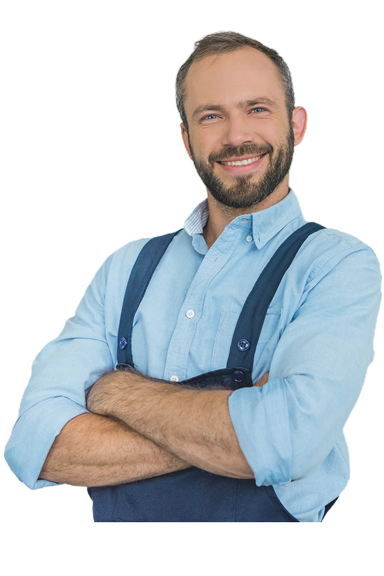 A repairman smiling posing with armed crossed.